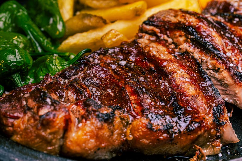 Colorful steak salad with roasted corn and peppers